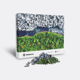 Split Seasons puzzle box with mound of pieces in front