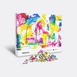 Modern art puzzle box with mound of pieces in front
