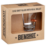 Shot glass with bullet imbedded in the side in retail packaging