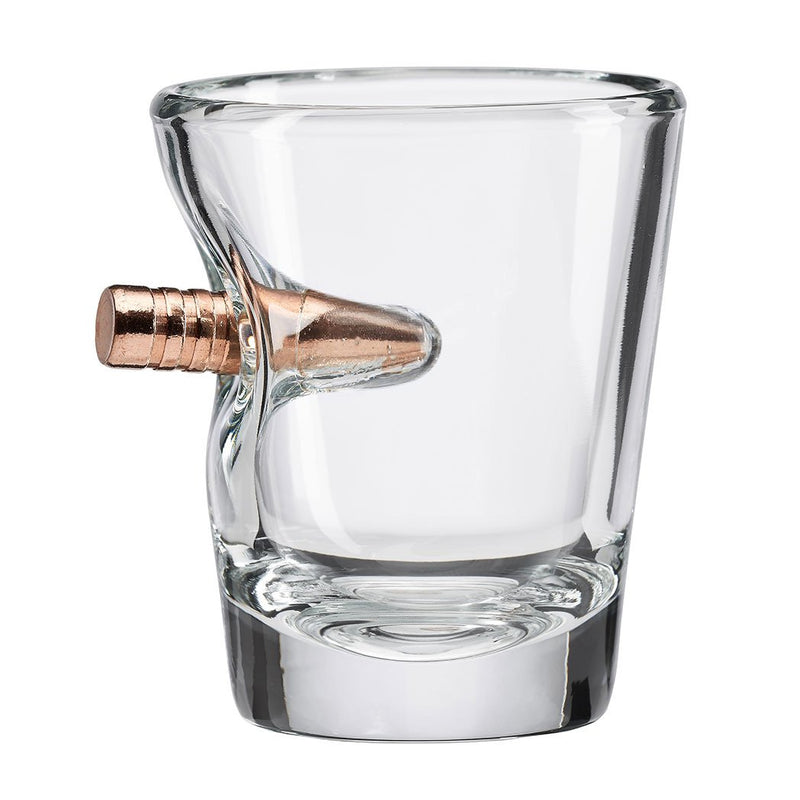 Shot glass with bullet imbedded in the side