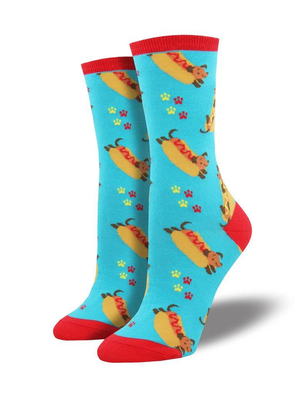 Blue socks featuring a playful scene of a dachshund in a hot dog bun