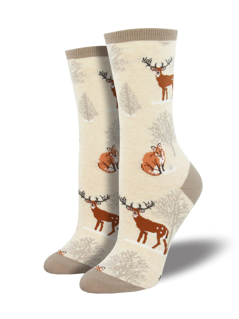 White socks featuring moose and fox in a winter forest.