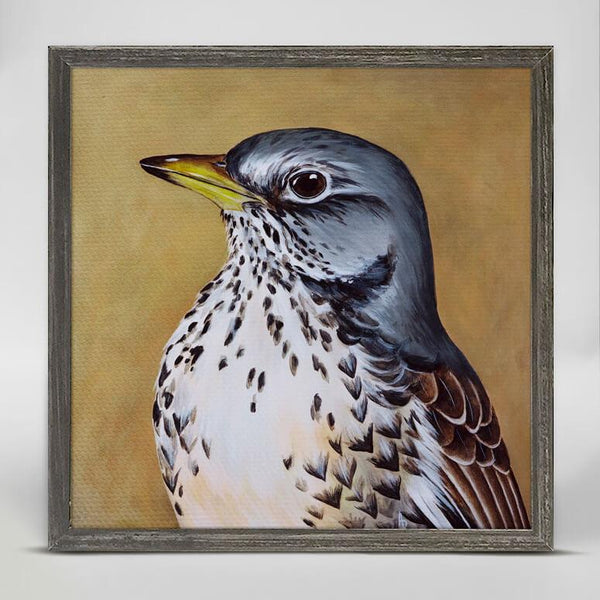 In a side pose, a blue and gray headed bird with brown feathers, white and speckled underbelly and a yellow beak is painted against a light brown background.