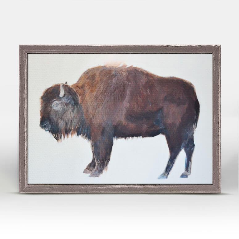 A side view of a bison in colorful print.