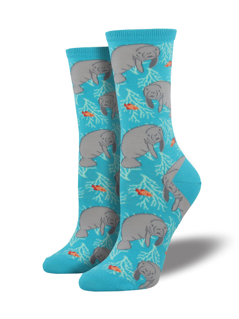 Blue sock featuring manatees and fish