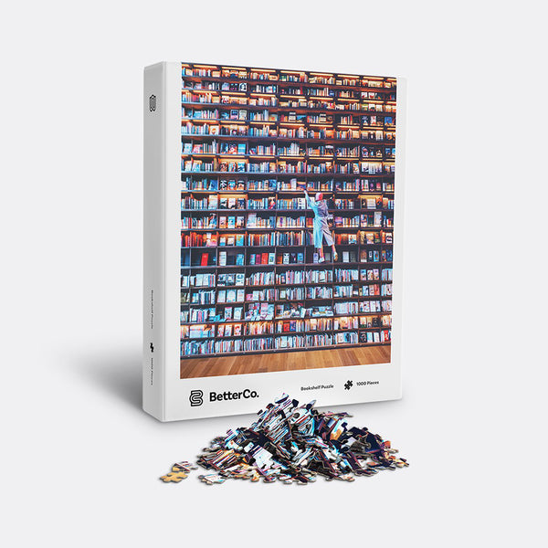 Bookshelf puzzle box with mound of pieces in front