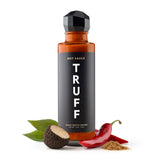 Truff Hot Sauce bottle with black truffle and chili pepper