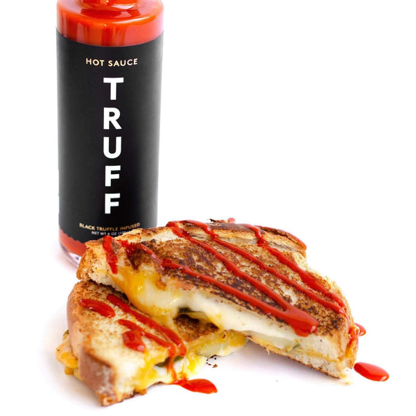 Truff Hot Sauce bottle with grilled cheese
