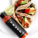 Truff Hot Sauce bottle with tacos