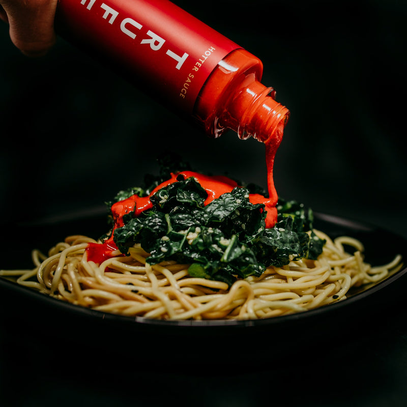 Truff Hotter Sauce bottle with pasta