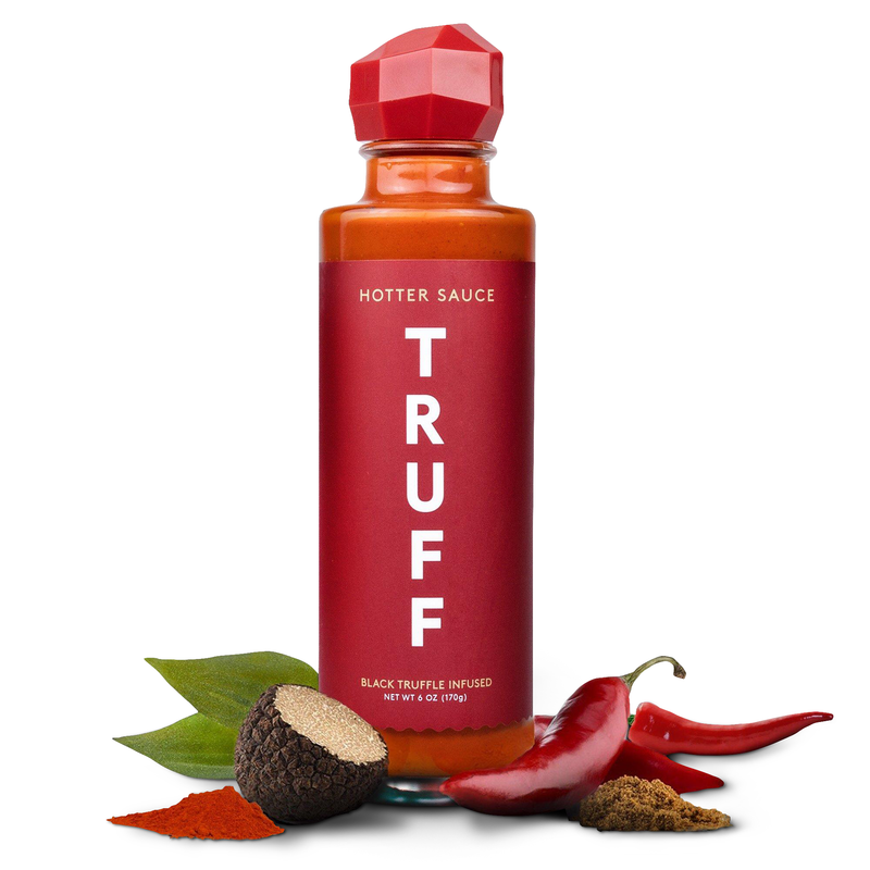 Truff Hotter Sauce bottle with black truffle and chili pepper