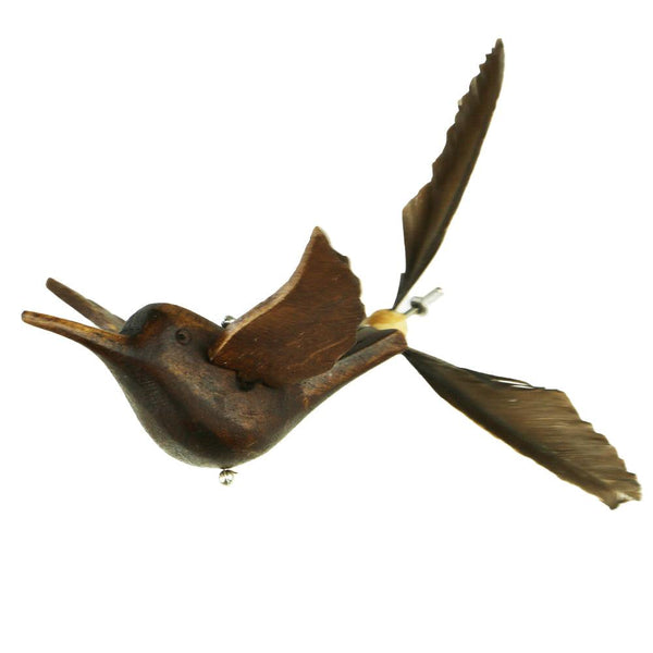 Closeup of Hummingbird Whirly Mobile showing hand carved flying hummingbird with duck feather tail.