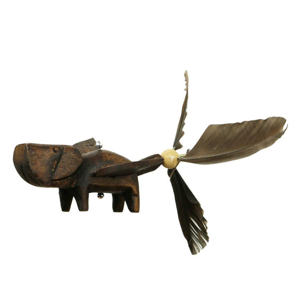 Closeup of Dog Whirly Mobile showing hand carved flying dog with duck feather tail.